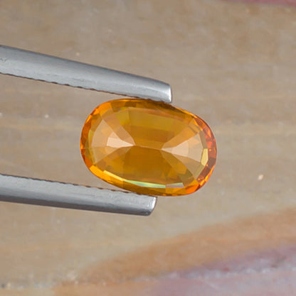 1.81ct Yellow Sapphire Colored Gemstone Bottom View Natural Background 
