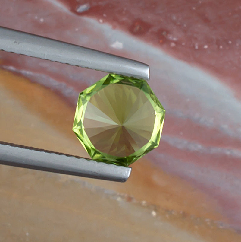 1.92ct Peridot Colored Gemstone Bottom View Natural Background 

