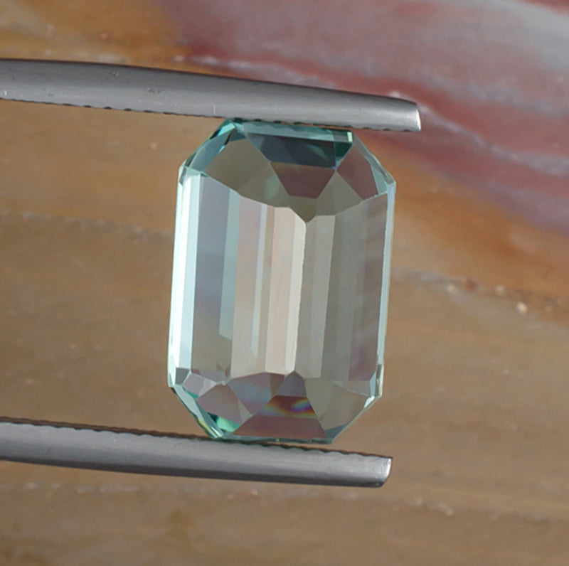 10.80ct Hiddenite Spodumene Bottom View Natural Background 
