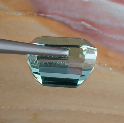 10.80ct Hiddenite Spodumene Side View Natural Background 
