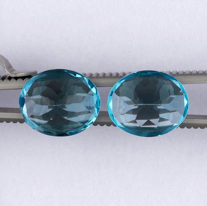 11.87twt Blue Topaz Colored Gemstone Pair Bottom View White Background 
