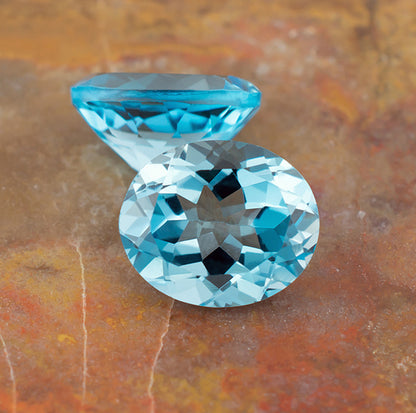 11.87twt Blue Topaz Colored Gemstone Pair Front Back View Natural Background 
