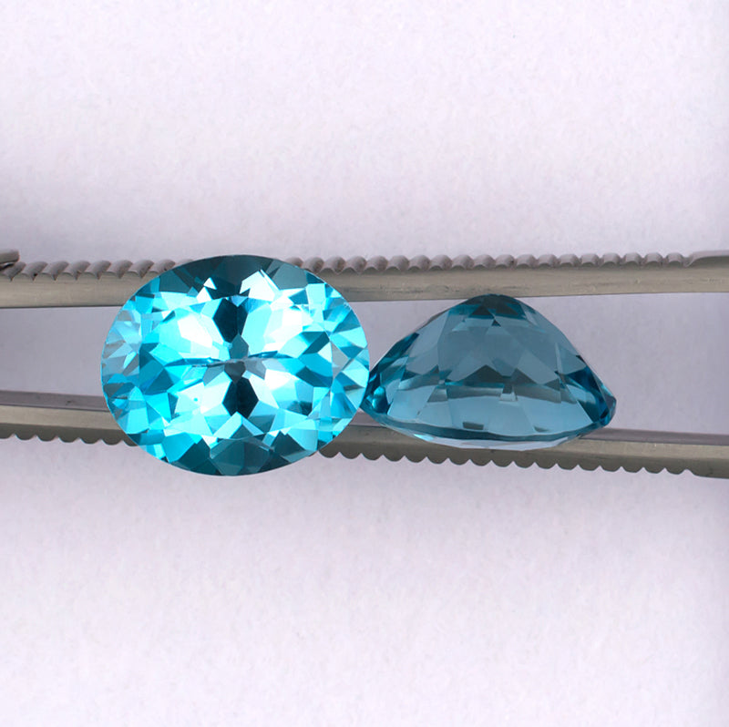 11.87twt Blue Topaz Colored Gemstone Pair Top Side View White Background
