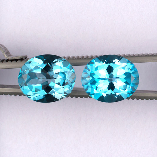 11.87twt Blue Topaz Colored Gemstone Pair Top View White Background 

