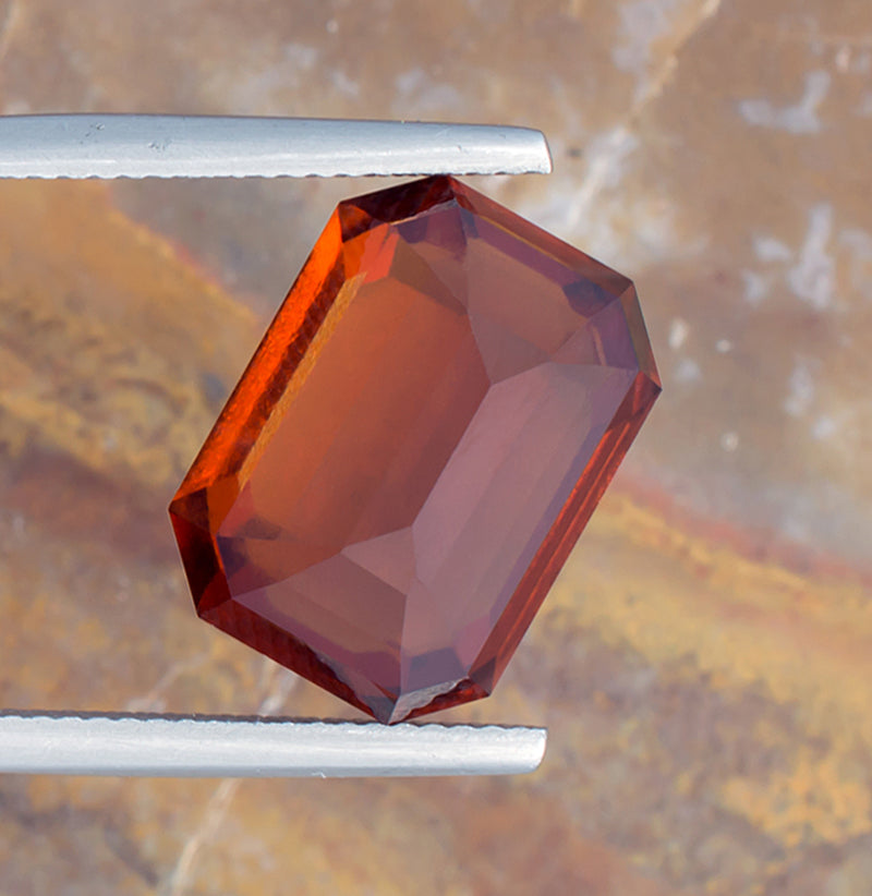 12.02ct Hessonite Garnet Colored Gemstone Bottom View Natural Background