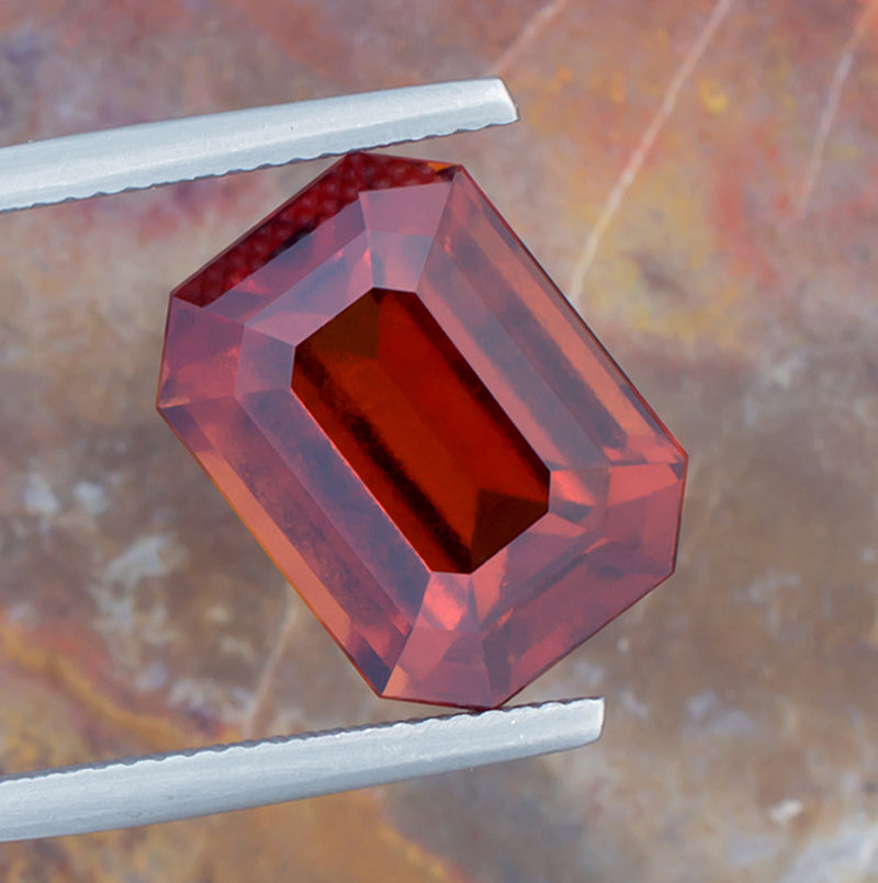 12.02ct Hessonite Garnet Colored Gemstone Top View Natural Background