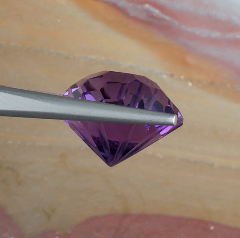 12.20ct Amethyst Colored Gemstone Side View Natural Background
