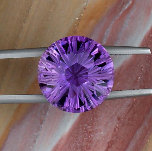 12.20ct Amethyst Colored Gemstone Top View Tweezers Natural Background
