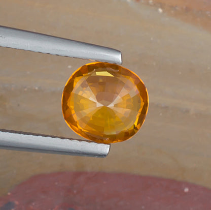 2.06ct Yellow Sapphire Colored Gemstone Bottom View Natural Background 
