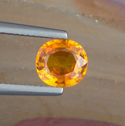 2.06ct Yellow Sapphire Colored Gemstone Top View Natural Background
