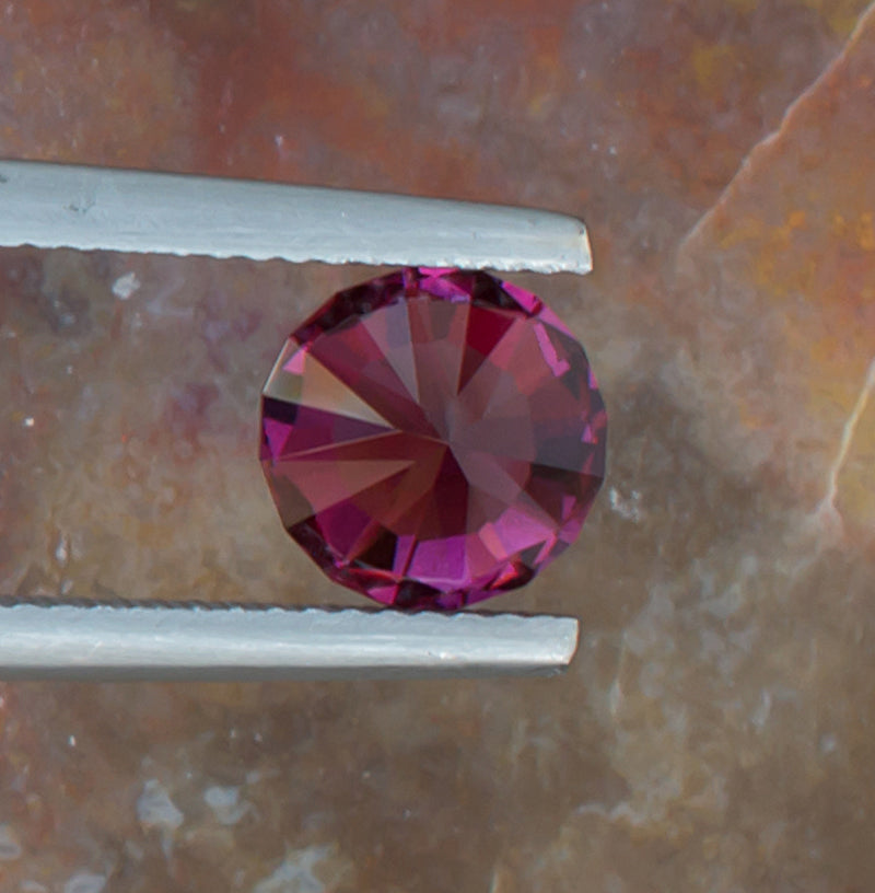 2.21ct Umbalite Garnet Colored Gemstone Bottom View Natural Background 
