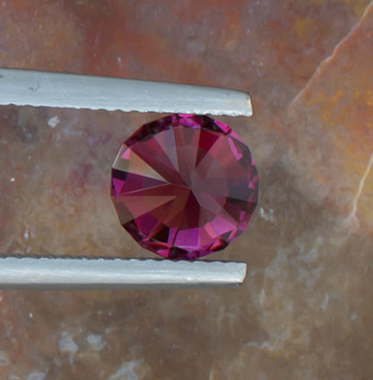2.21ct Umbalite Garnet Colored Gemstone Bottom View Natural Background 
