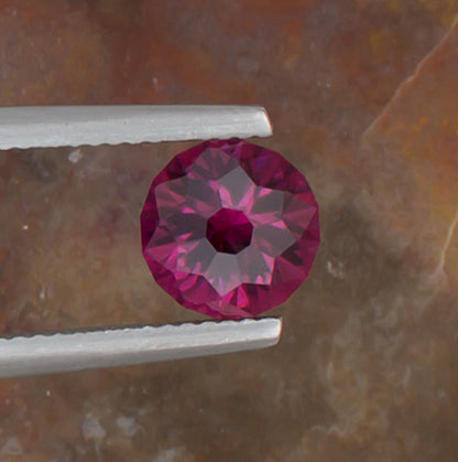 2.21ct Umbalite Garnet Colored Gemstone Top View Natural Background 
