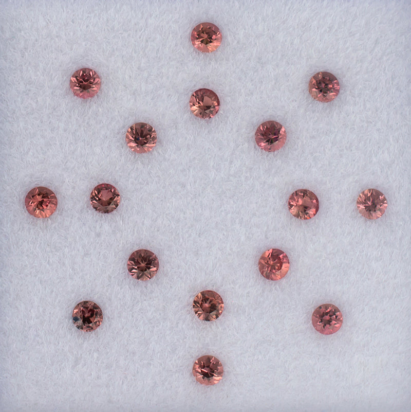 2.30mm Orange Sapphire Colored Gemstone Melee Parcel Top View White Background 

