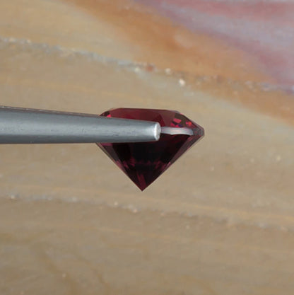 2.46ct Rhodolite Garnet Colored Gemstone Side View Natural Background 
