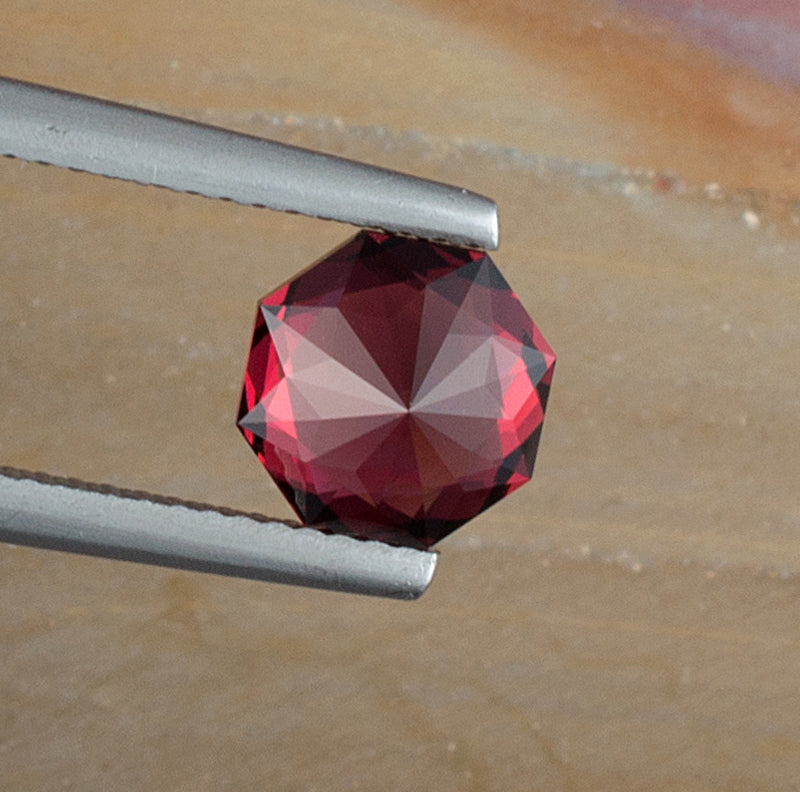 2.52ct Umbalite Garnet Colored Gemstone Bottom View Natural Background 
