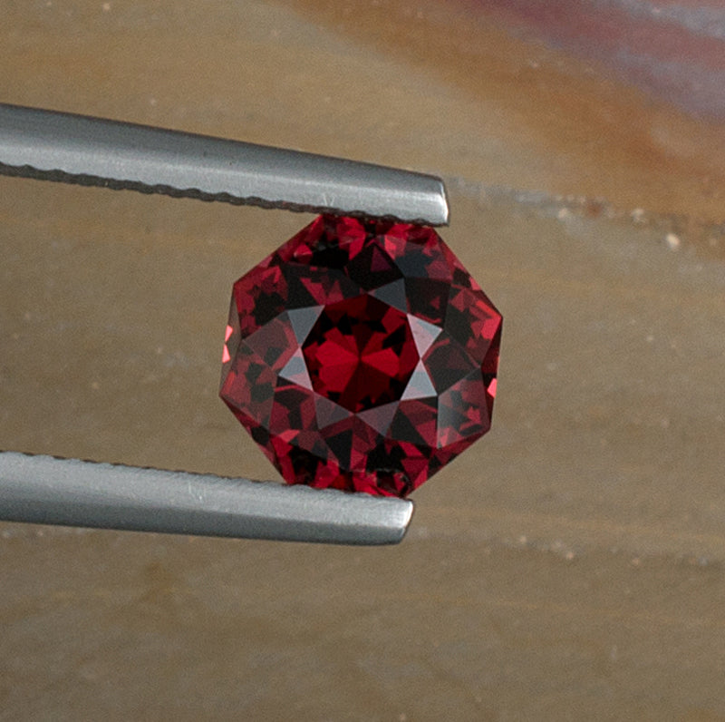2.52ct Umbalite Garnet Colored Gemstone Top View Natural Background 
