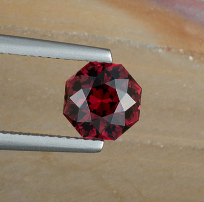 2.52ct Umbalite Garnet Colored Gemstone Top View Natural Background 
