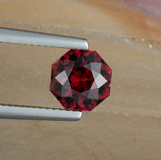 2.52ct Umbalite Garnet Colored Gemstone Top View Natural Background 
