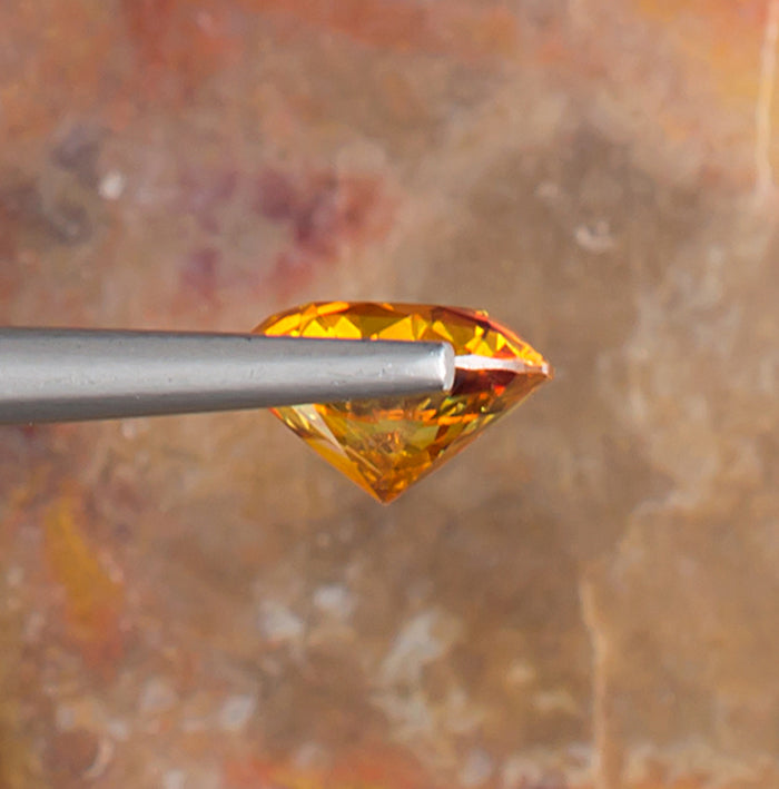 2.65ct Sphalerite Colored Gemstone Side View Natural Background 
