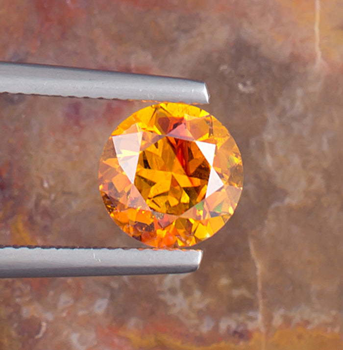 2.65ct Sphalerite Colored Gemstone Top View Natural Background 
