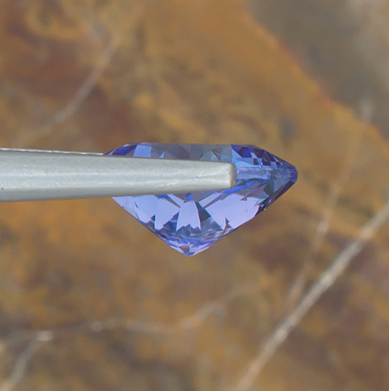 3.08ct Tanzanite Colored Gemstone Side View Natural Background