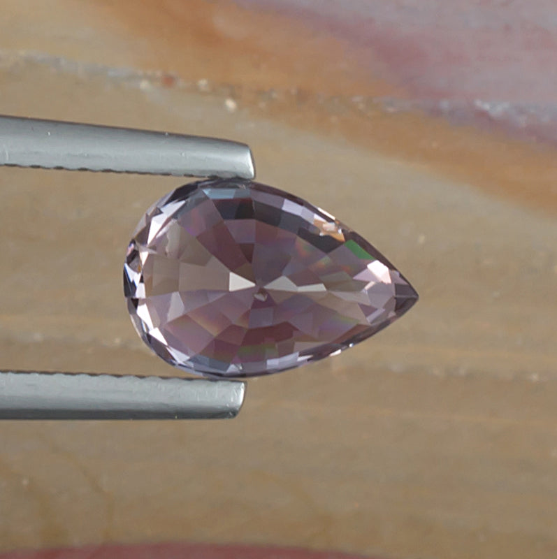 3.19ct Purple Spinel Colored Gemstone Bottom View Natural Background 
