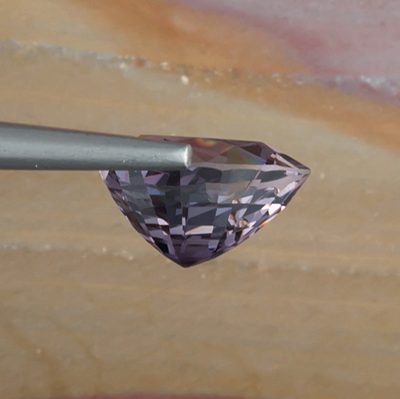 3.19ct Purple Spinel Colored Gemstone Side View Natural Background 
