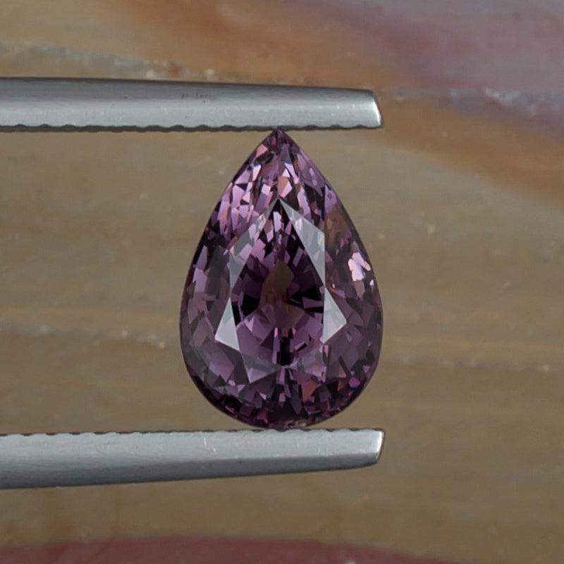 3.19ct Purple Spinel Colored Gemstone Top View Natural Background 
