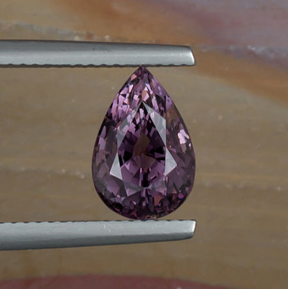 3.19ct Purple Spinel Colored Gemstone Top View Natural Background 
