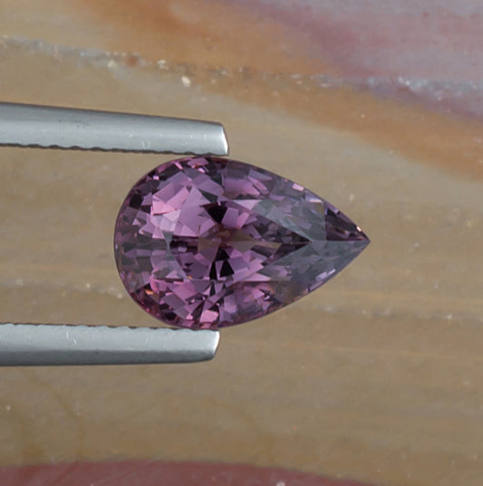 3.19ct Purple Spinel Colored Gemstone Top View Natural Background
