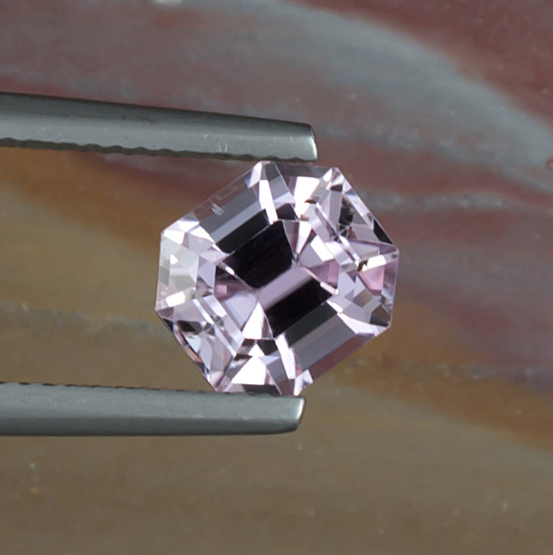 3.23ct Kunzite Colored Gemstone Top View Natural Background 
