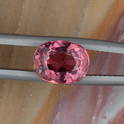 3.25ct Pink Sapphire Colored Gemstone Top View Natural Background H 21063
