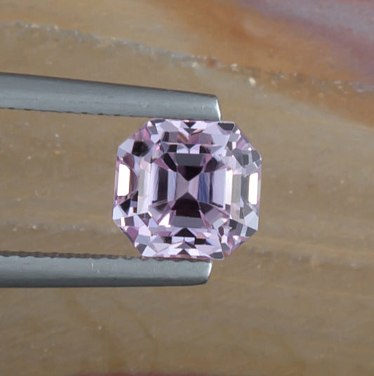 3.29ct Kunzite Colored Gemstone Top View Natural Background 
