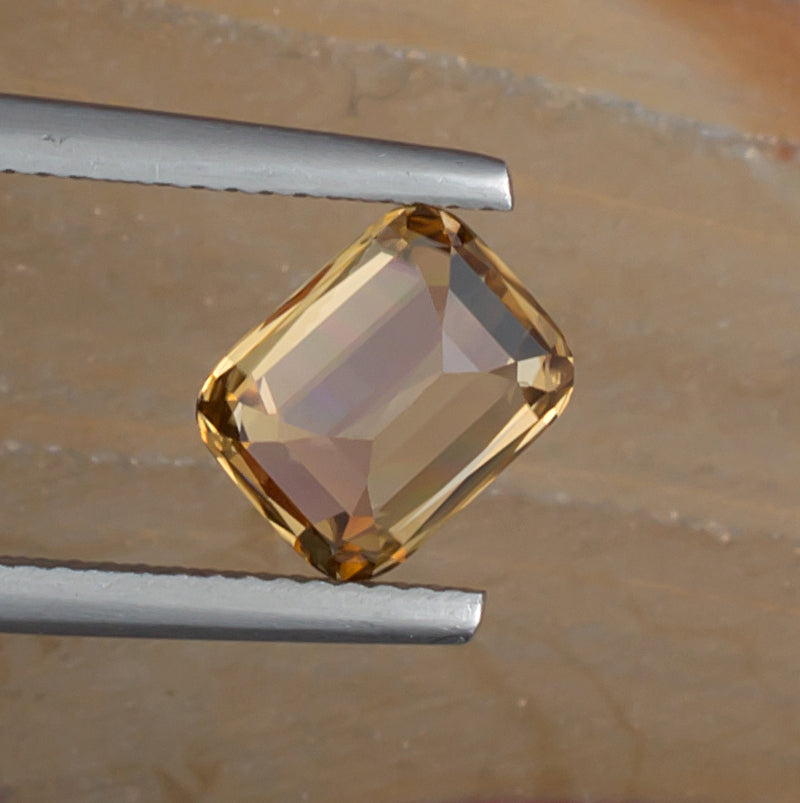 3.38ct Golden Zircon Colored Gemstone Bottom View Natural Background 
