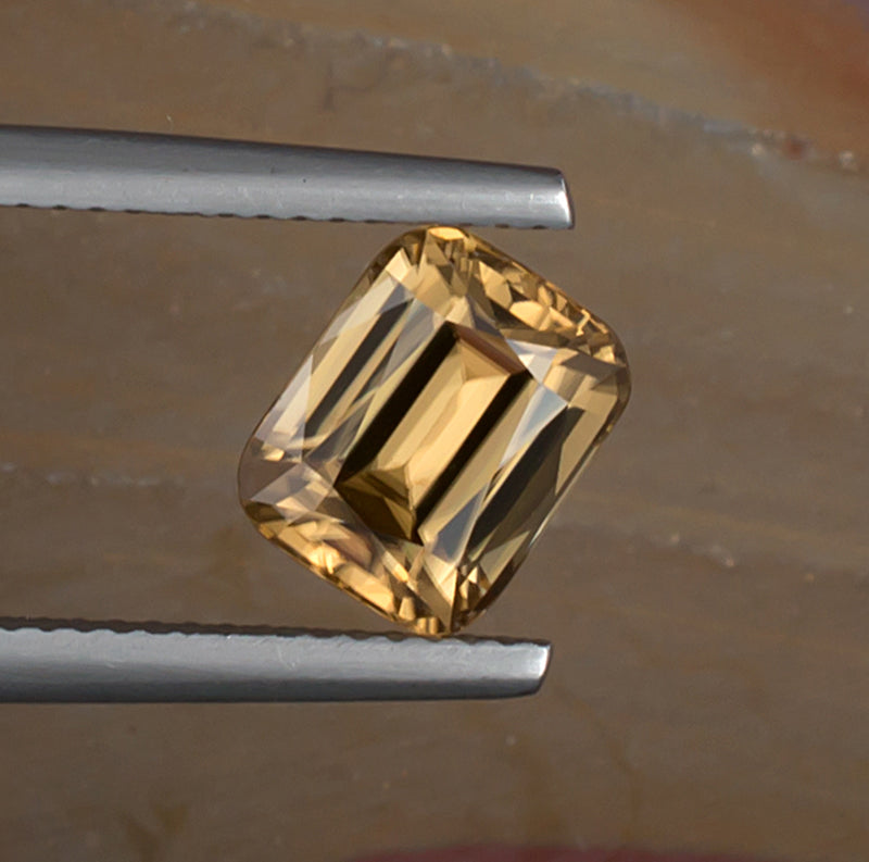 3.38ct Golden Zircon Colored Gemstone Top View Natural Background 
