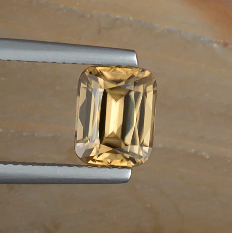 3.38ct Golden Zircon Colored Gemstone Top View Natural Background 
