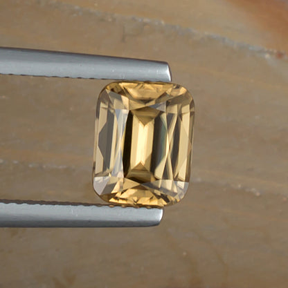 3.38ct Golden Zircon Colored Gemstone Top View Natural Background 
