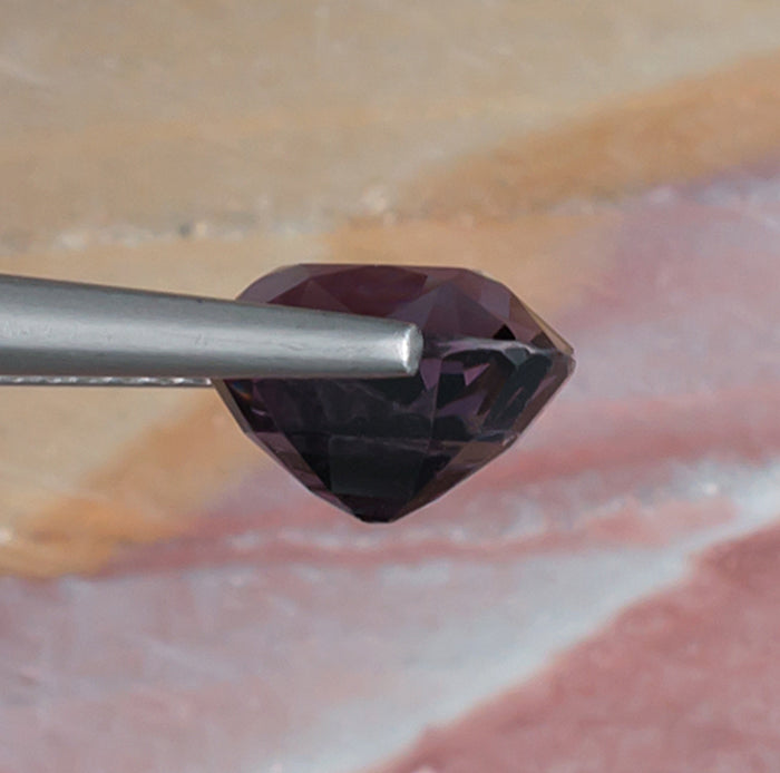 3.41ct Lavender Spinel Colored Gemstone Side View Natural Background 
