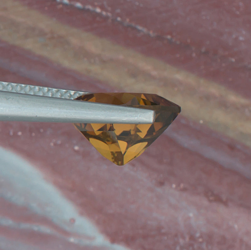 3.53ct Citrine Colored Gemstone Bottom View Natural Background 