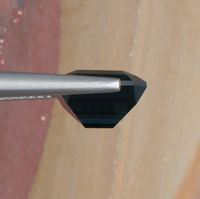 3.55ct Blue Spinel Colored Gemstone Side View Natural Background 
