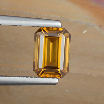 3.73ct Yellow Zircon Colored Gemstone Top View Natural Background 
