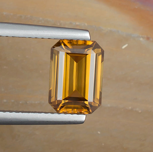 3.73ct Yellow Zircon Colored Gemstone Top View Natural Background 

