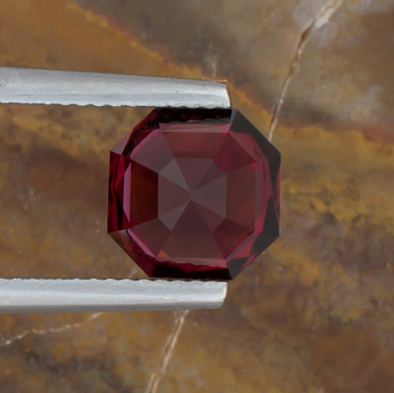 3.74ct Mahenge Garnet Colored Gemstone Bottom View Natural Background 
