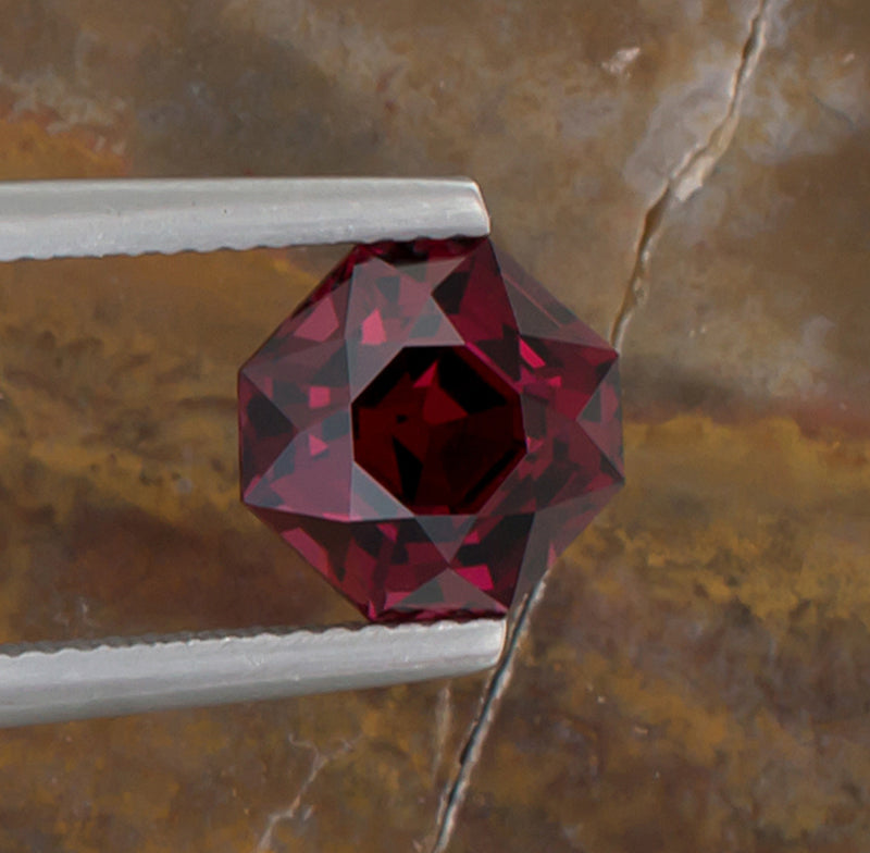 3.74ct Mahenge Garnet Colored Gemstone Top View Natural Background 
