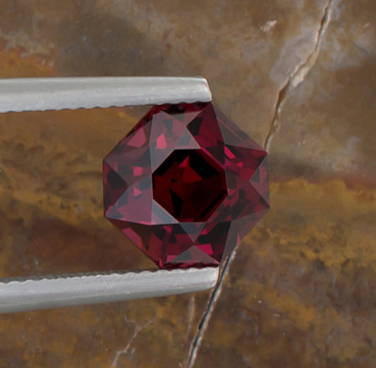 3.74ct Mahenge Garnet Colored Gemstone Top View Natural Background 
