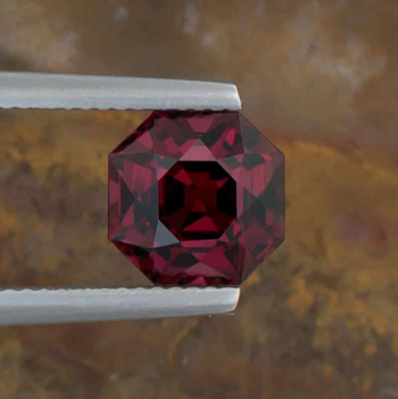 3.74ct Mahenge Garnet Colored Gemstone Top View Natural Background 
