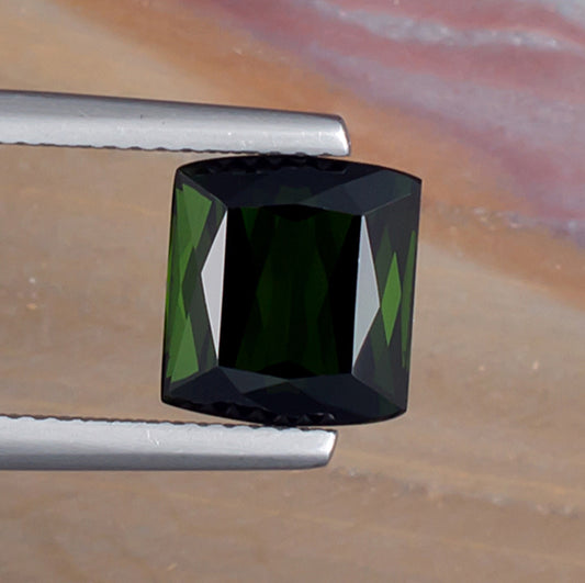 3.99ct Green Tourmaline Colored Gemstone Top View Natural Background 
