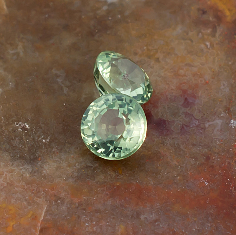 4.20mm Green Sapphire Colored Gemstone Pair Top View Natural Background
