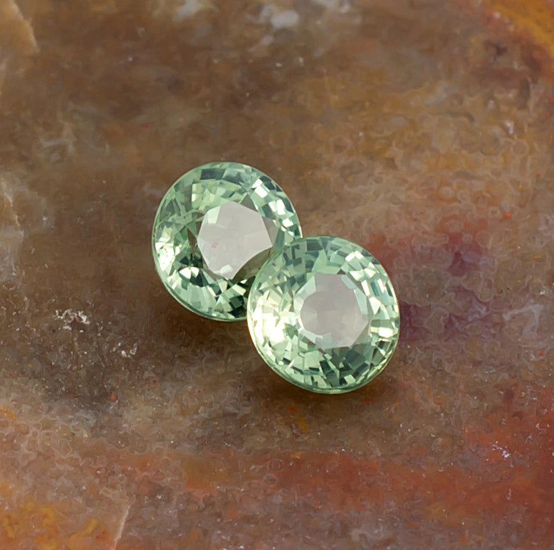 4.20mm Green Sapphire Colored Gemstone Pair Top View Natural Background 
